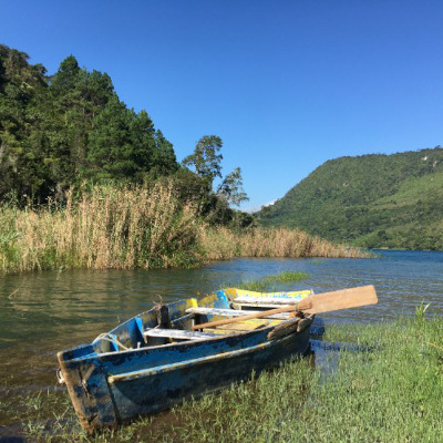 View of the lake with a kayak on the horizon